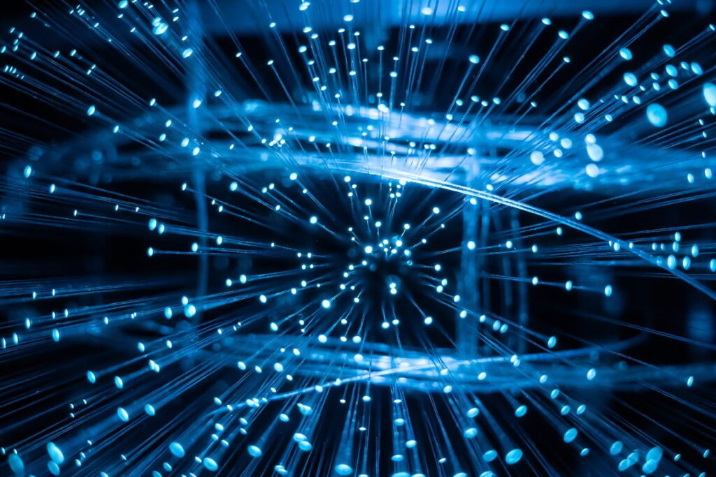 Optical fiber strands carrying pulses of blue light, the medium distributed acoustic sensing turns into a continuous array of sensors