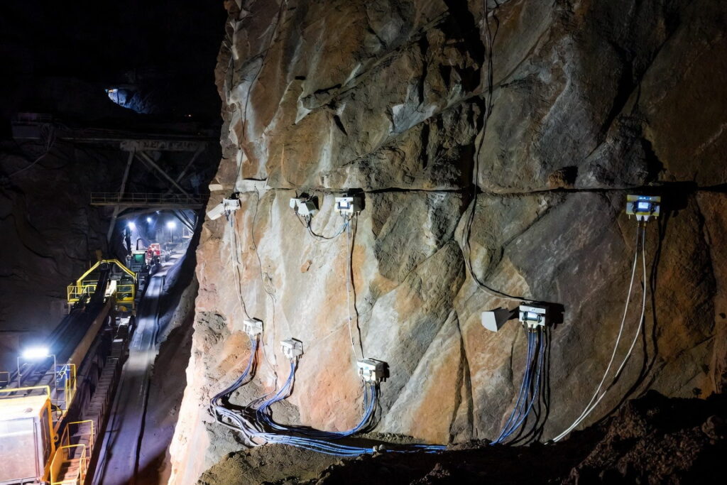 Sensor array wired along the rock wall of an underground mine tunnel, the coverage problem seismic monitoring in mining has to solve